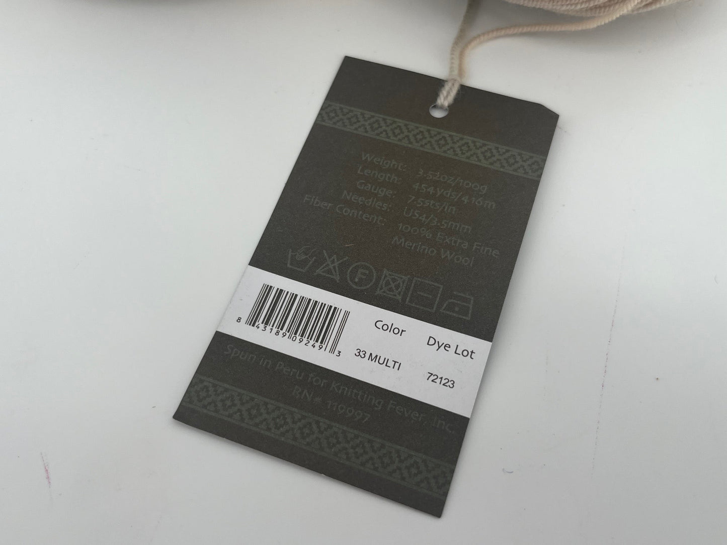 Yarn tag with product information on a white background